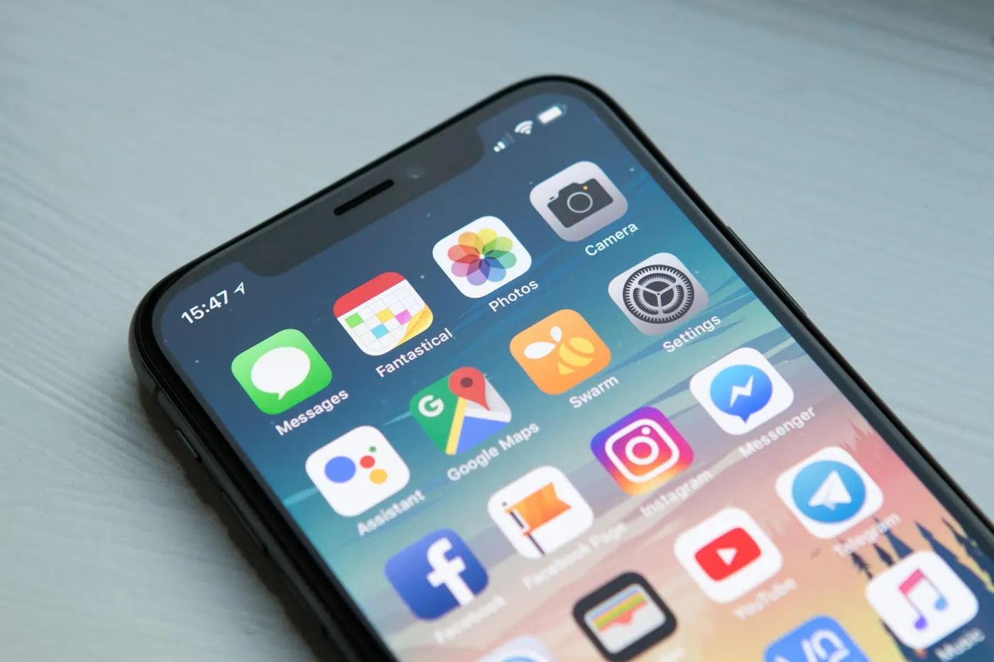 Smartphone held in hand showing a mobile app interface